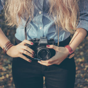 Woman with vintage retro camera