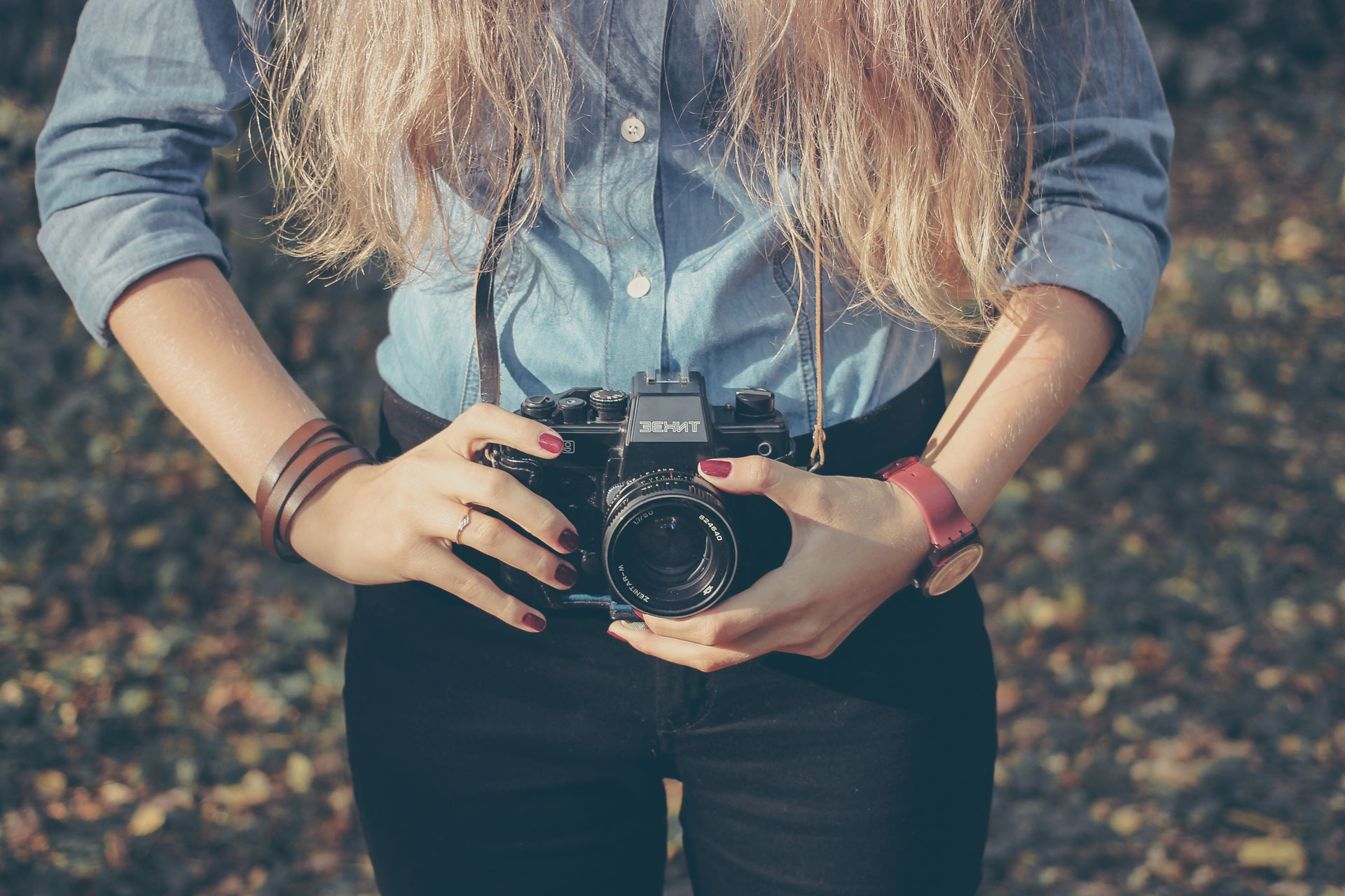 Woman with vintage retro camera